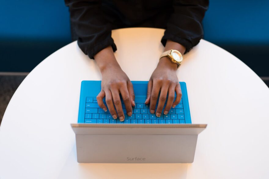 person typing on a laptop