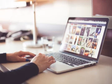 Free woman's hands using laptop